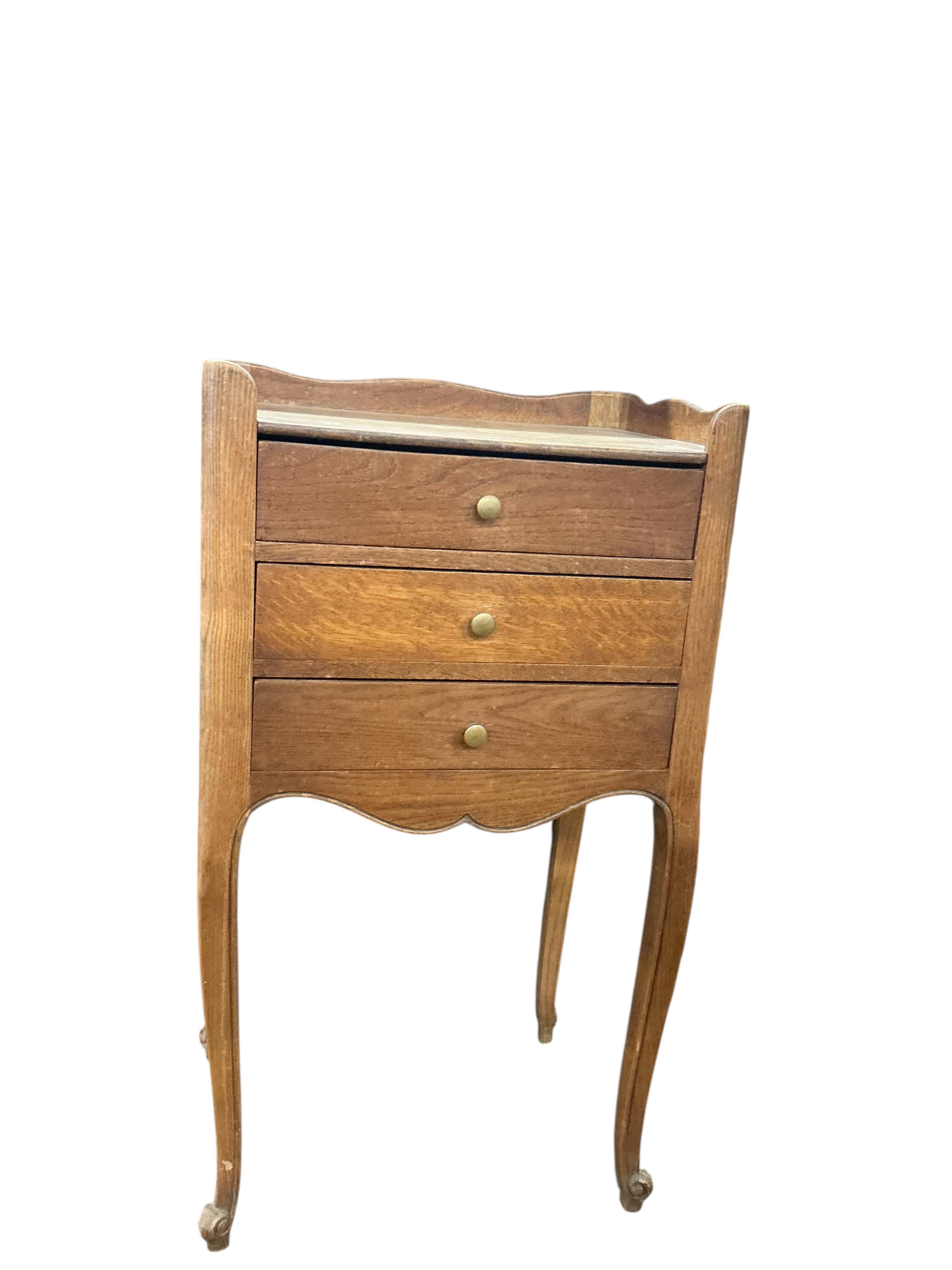 An early 20th century French oak tray top bedside chest, width 43cm, depth 32cm, height 77cm